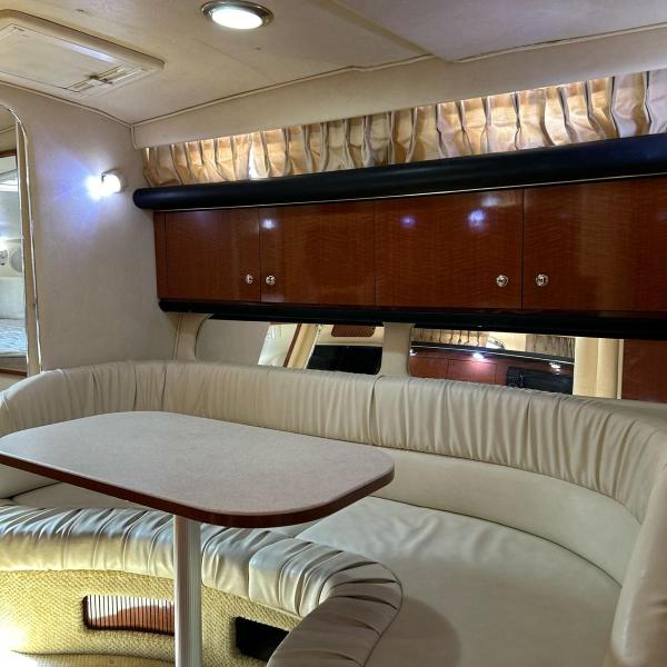 a bedroom with a bed and a chair in a room