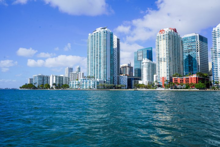 a large body of water with a city in the background